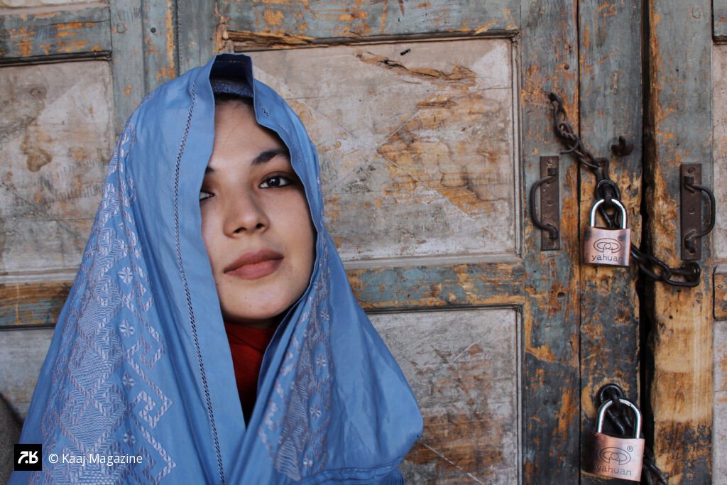Young Afghan girl draped in Burqa