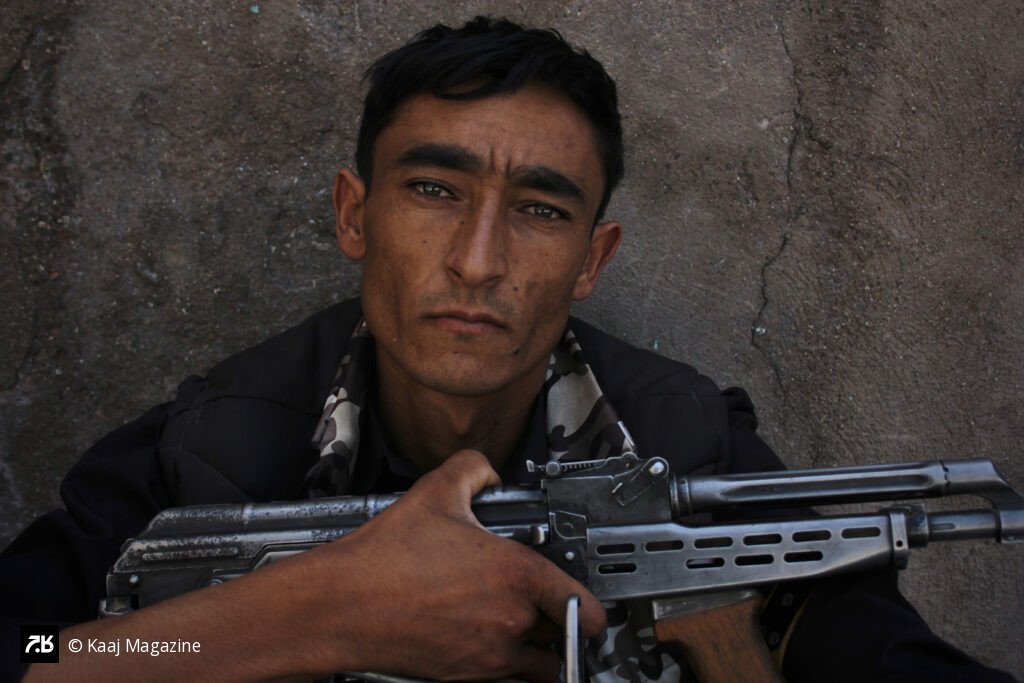 Soldier resting with his rifle