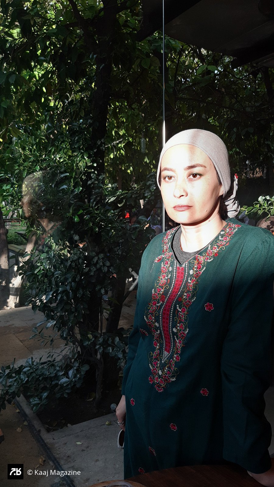 Woman in an embroidered green dress