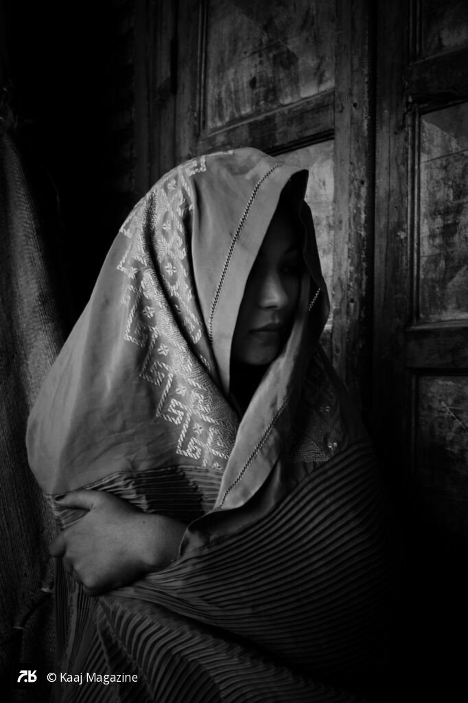 Black and white portrait of a woman in a burqa