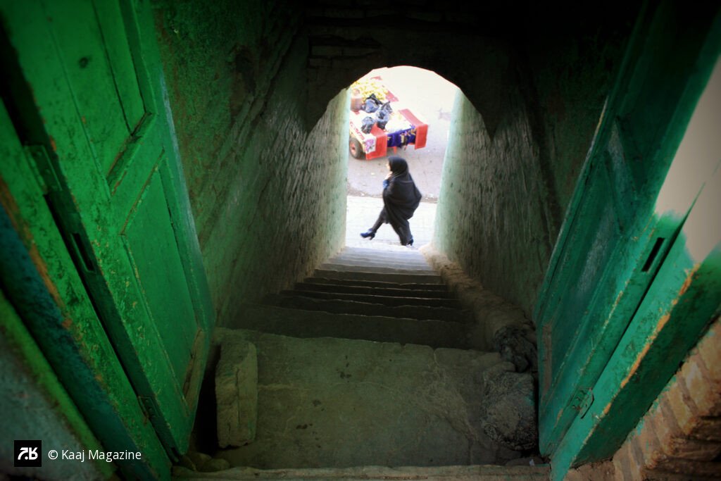 View through a green wooden doorway