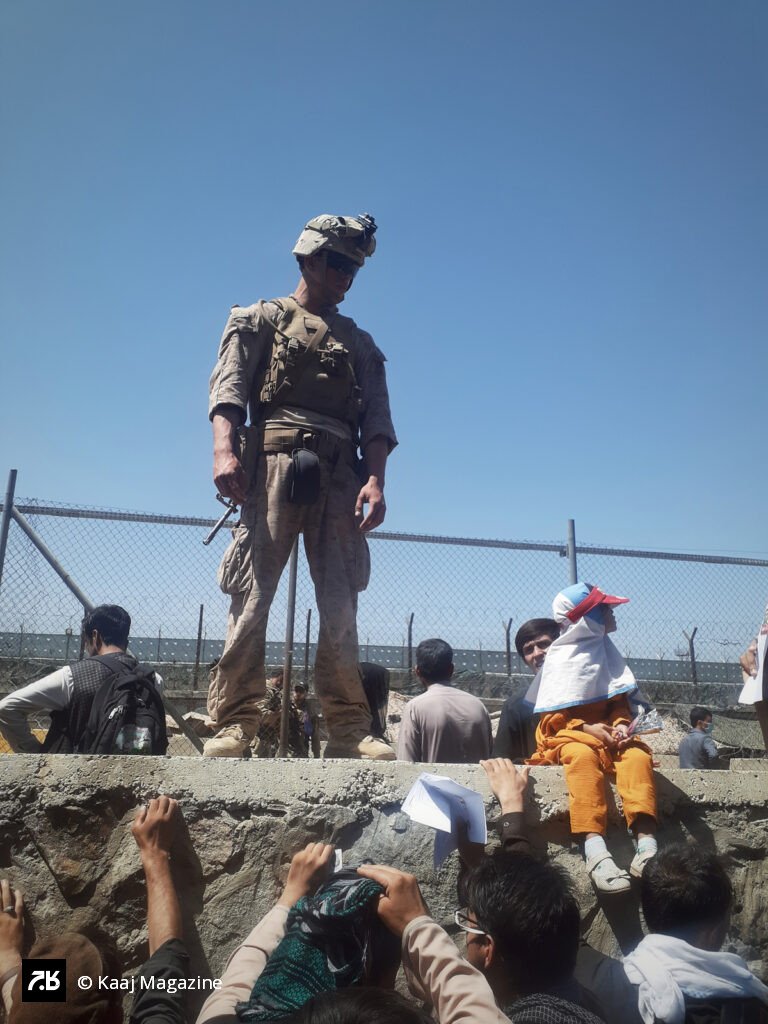 American Soldier standing guard above a crowd